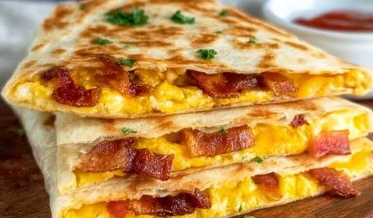 Crispy Bacon Egg and Cheese Breakfast Quesadillas stacked and served hot