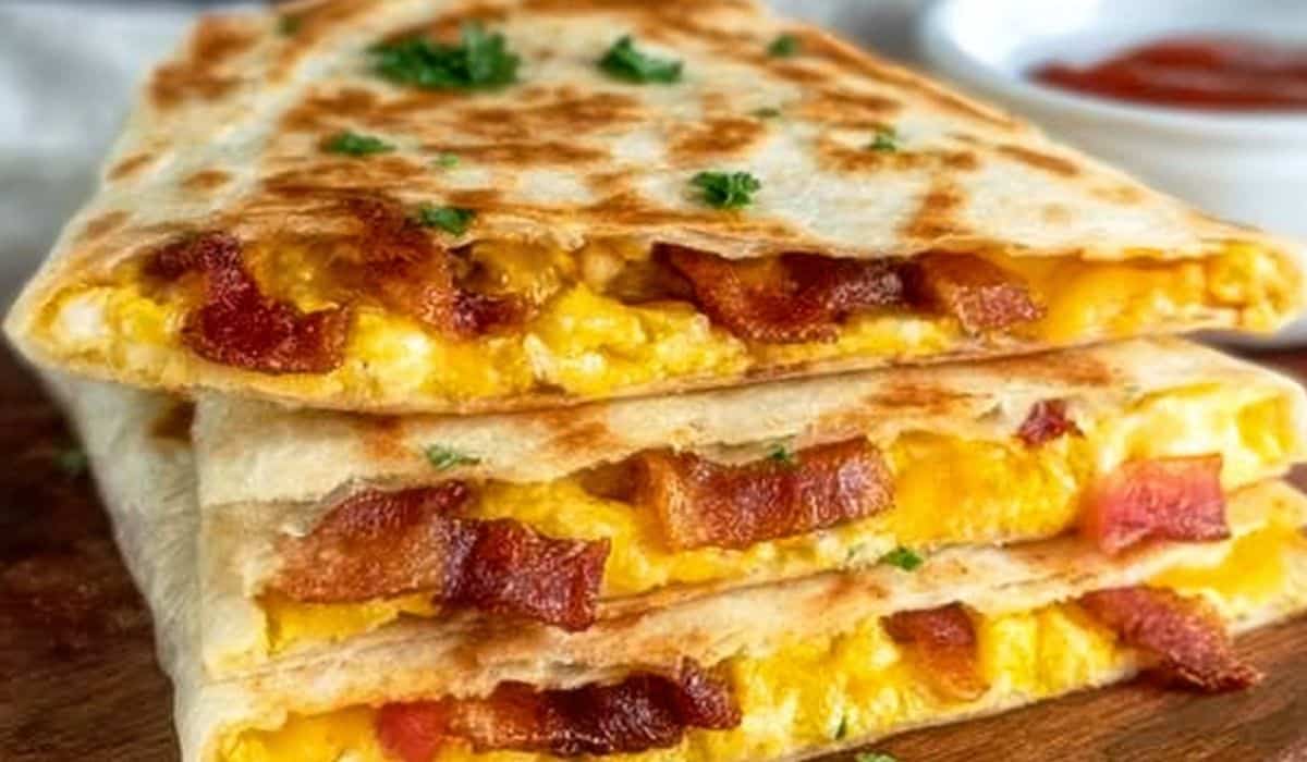 Crispy Bacon Egg and Cheese Breakfast Quesadillas stacked and served hot