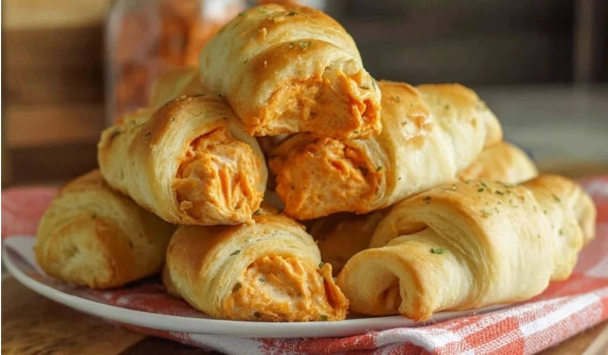 Buffalo Chicken Crescent Rolls stacked on a white plate