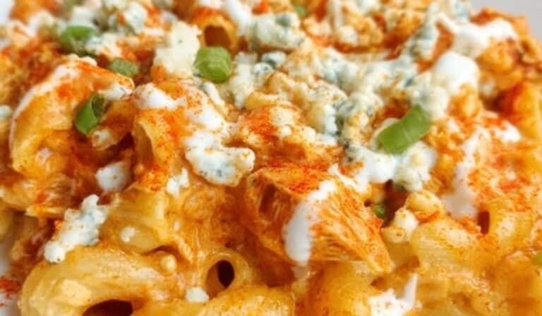 Buffalo Chicken Mac and Cheese topped with ranch, blue cheese, and green onions