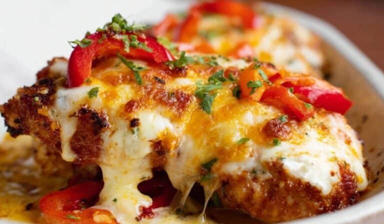 Cajun Chicken With Sweet Peppers topped with melted cheese and fresh herbs