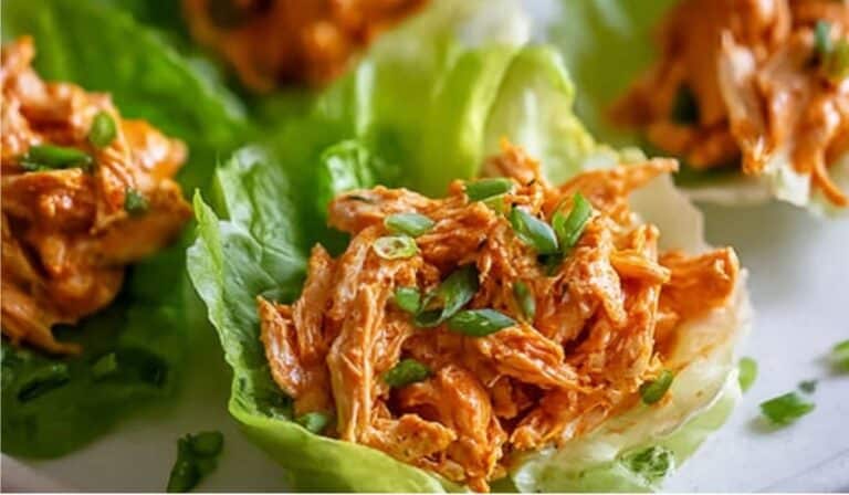 Buffalo Chicken Lettuce Wraps served in fresh romaine leaves with buffalo sauce