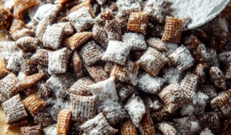 Chex Mix Puppy Chow coated with powdered sugar
