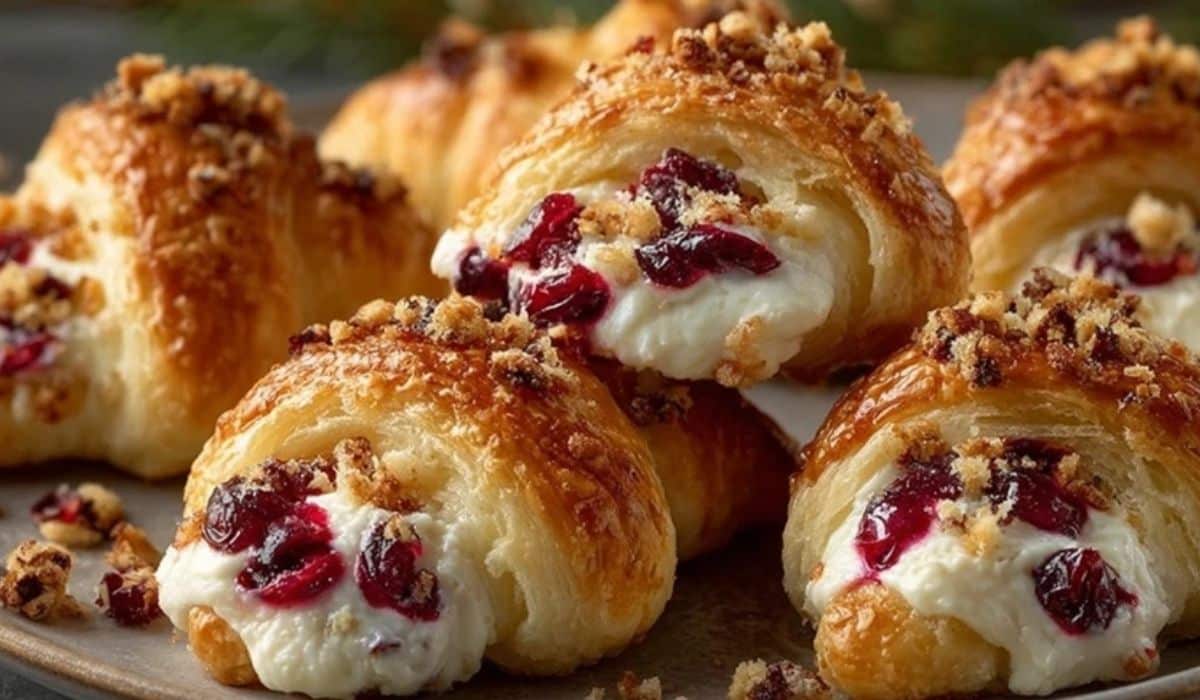 Cranberry Cream Cheese Crescent Bites on a plate with flaky pastry and creamy filling