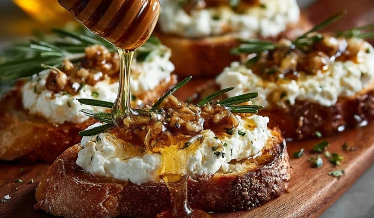 Spicy Honey Drizzled Feta Crostini Delight with fresh rosemary and walnut honey topping