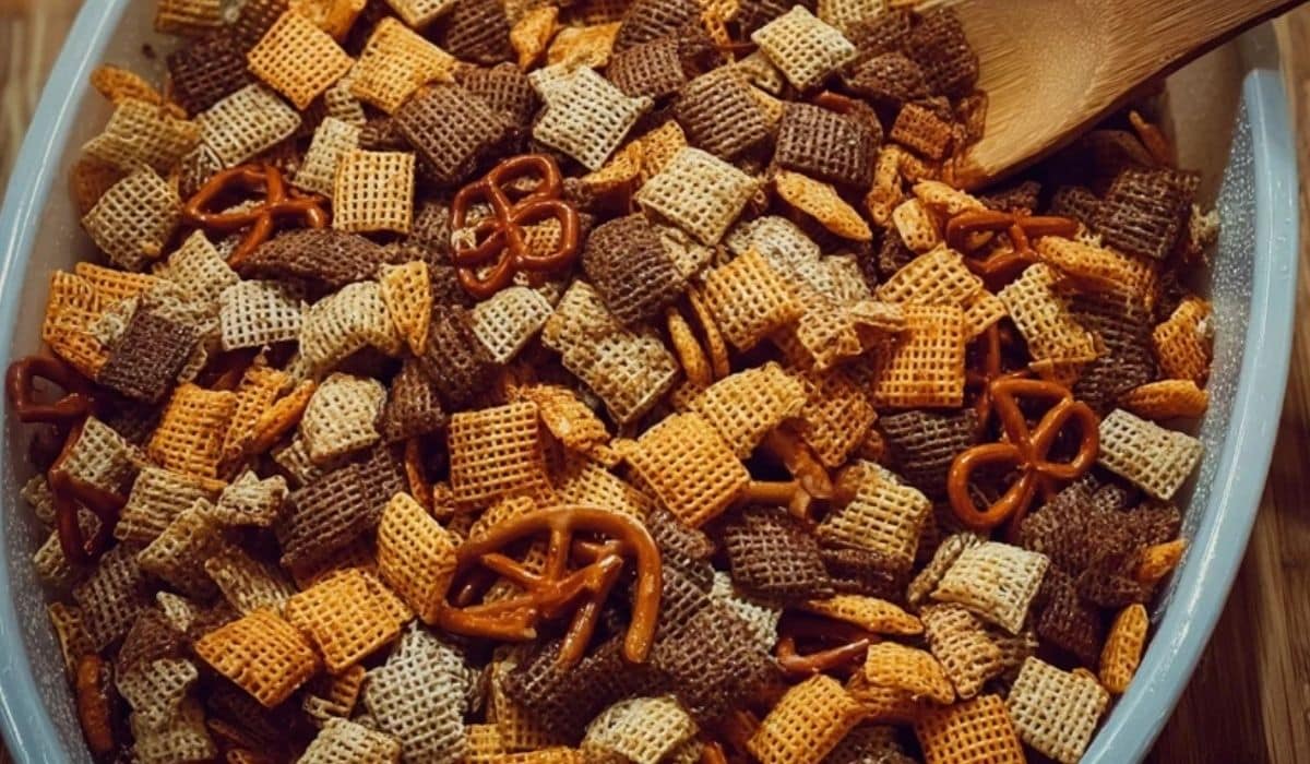 The Best Chex Mix in a bowl with pretzels, rye chips, and Chex cereal