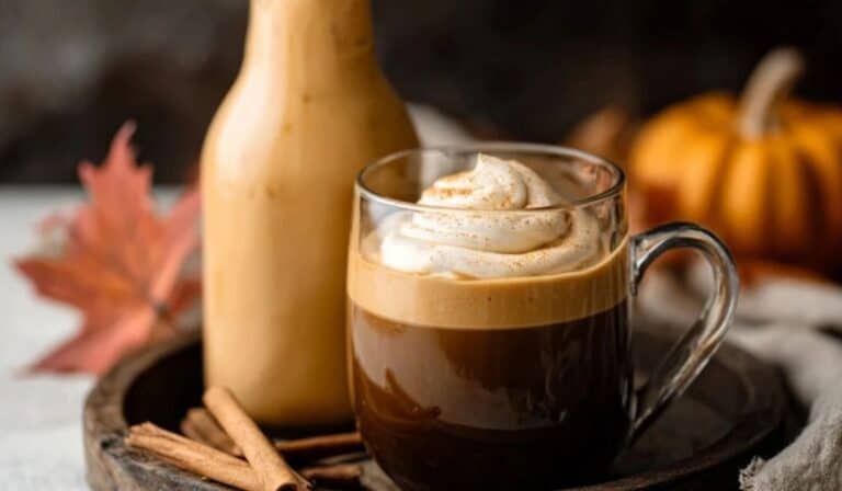Homemade Pumpkin Coffee Creamer served with coffee in a fall setting