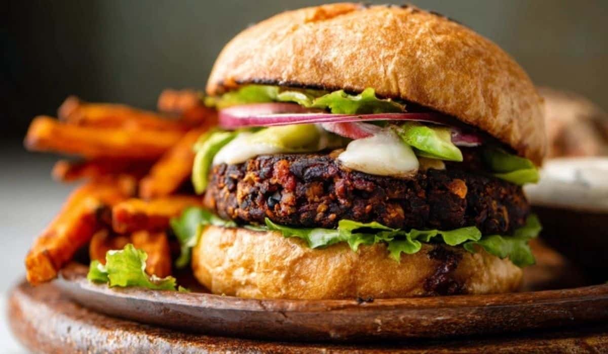 The Best Black Bean Burgers on a rustic plate with fries