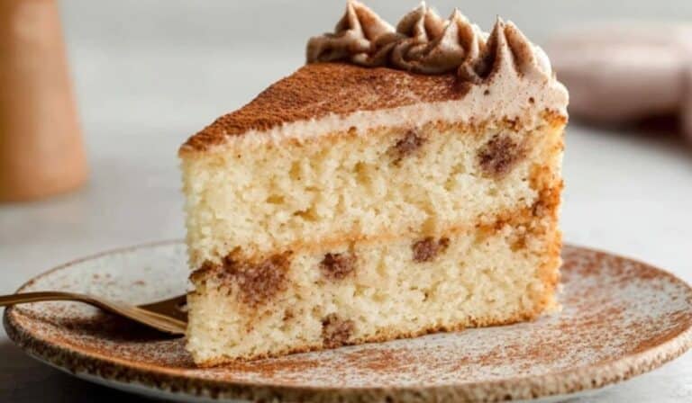 Snickerdoodle Cake slice served on ceramic plate