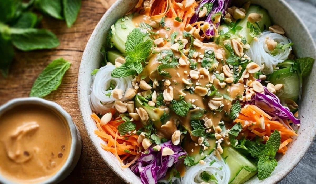 Refreshing Spring Roll Salad with Peanut Dressing served in a large white bowl