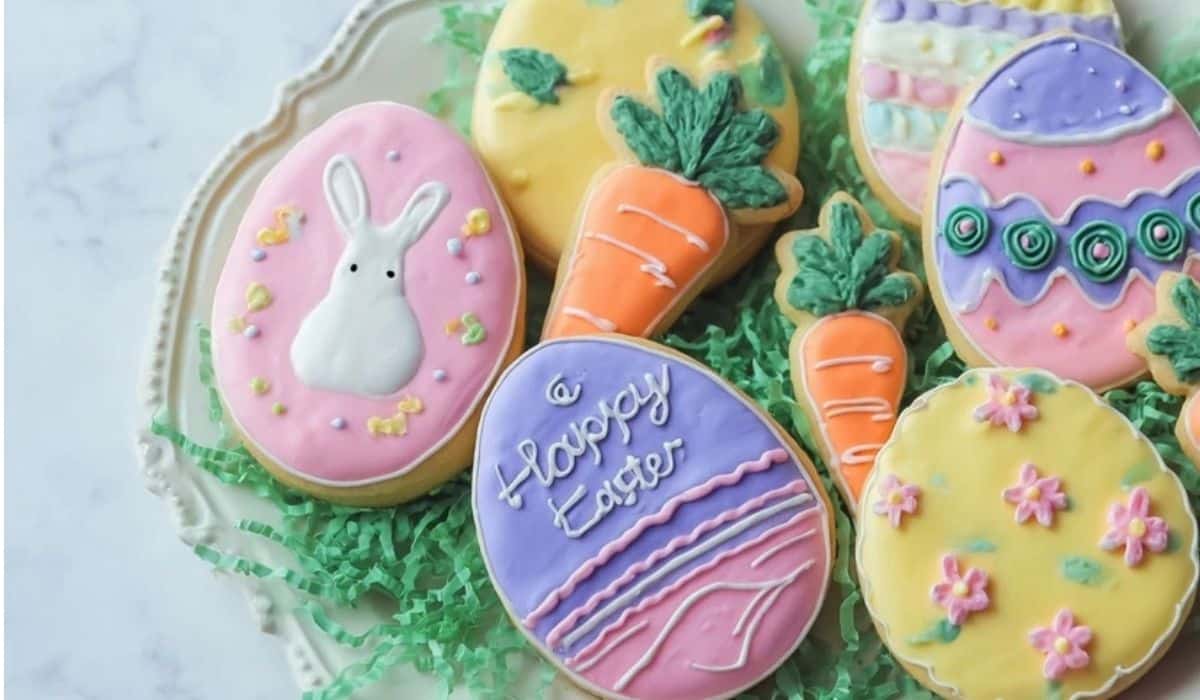Decorated Easter cookies on a tray with pastel icing and spring shapes
