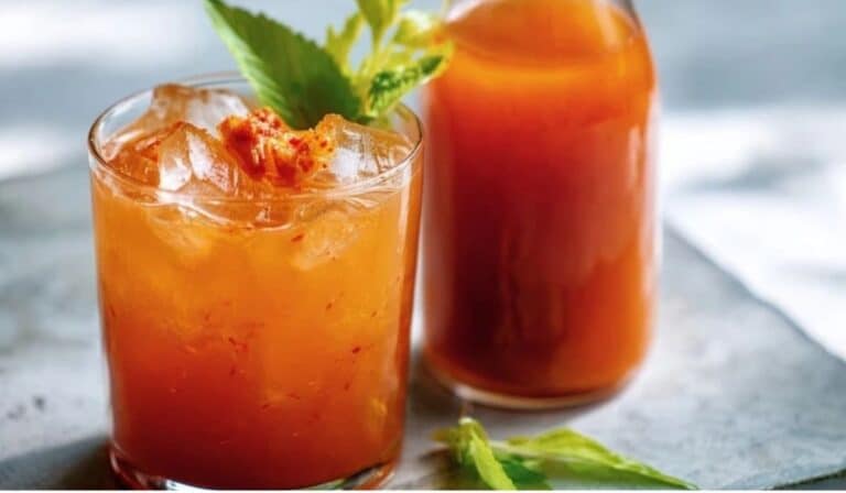 Kimchi cocktail mixer base in a glass bottle with a savory brunch drink