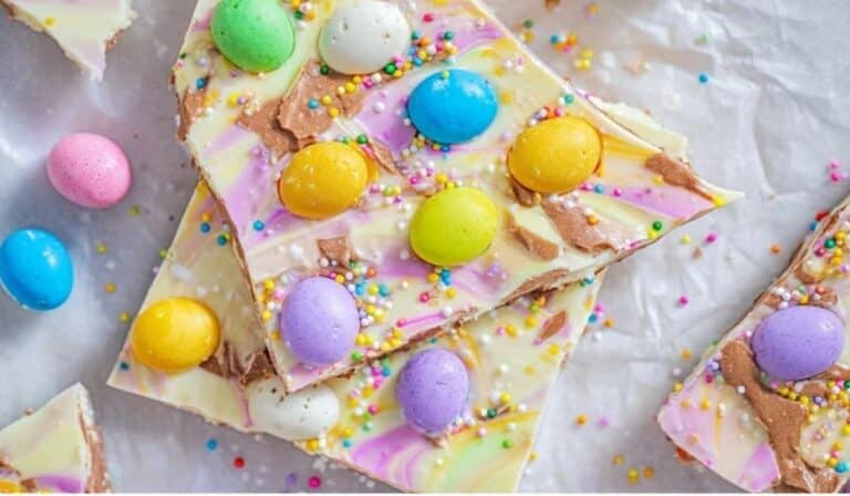 No-bake Easter bark broken into pastel chocolate pieces with mini eggs