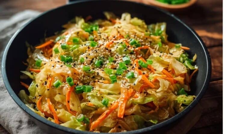 Quick cabbage stir fry in a skillet with carrots and sesame